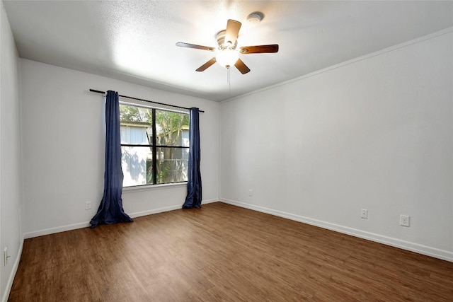 empty room featuring dark hardwood / wood-style floors and ceiling fan