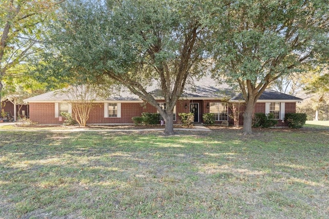 ranch-style house featuring a front lawn