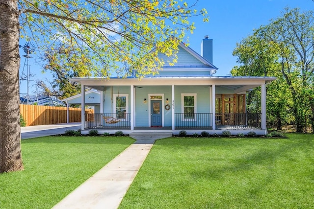 farmhouse with a porch and a front yard