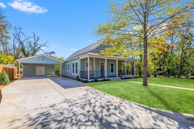 view of front of house featuring covered porch, a front lawn, and a carport