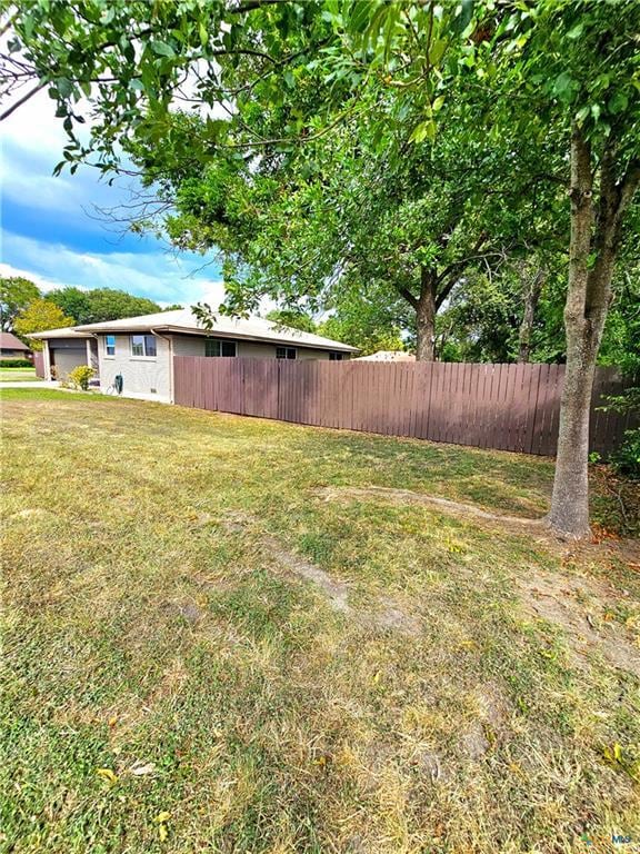 view of yard featuring fence