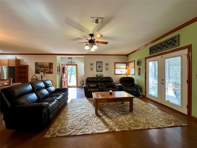 living room with crown molding, french doors, and ceiling fan