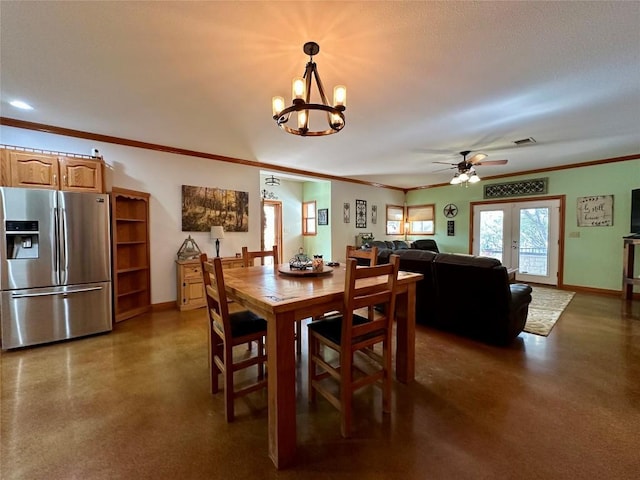 dining room with ceiling fan with notable chandelier, crown molding, and french doors