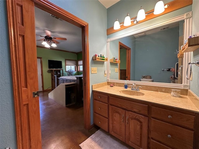 bathroom with vanity, concrete floors, ceiling fan, and crown molding