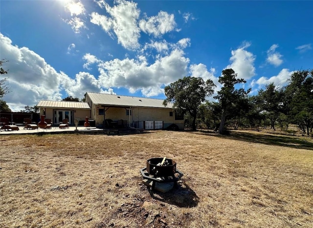 rear view of property featuring a patio area