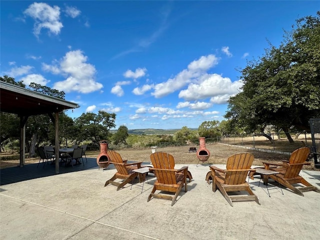 view of patio / terrace featuring a fire pit