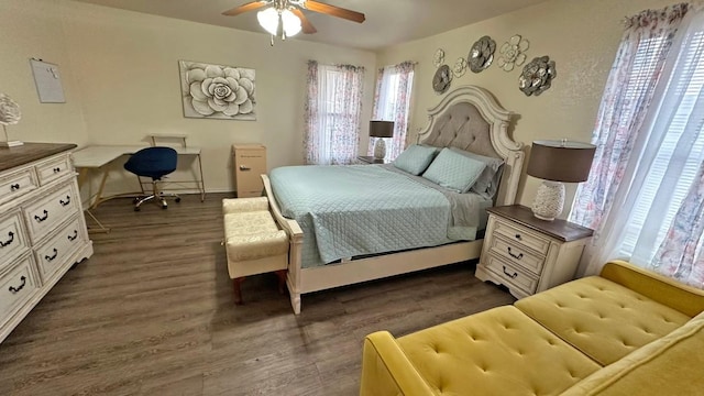 bedroom featuring dark hardwood / wood-style flooring and ceiling fan