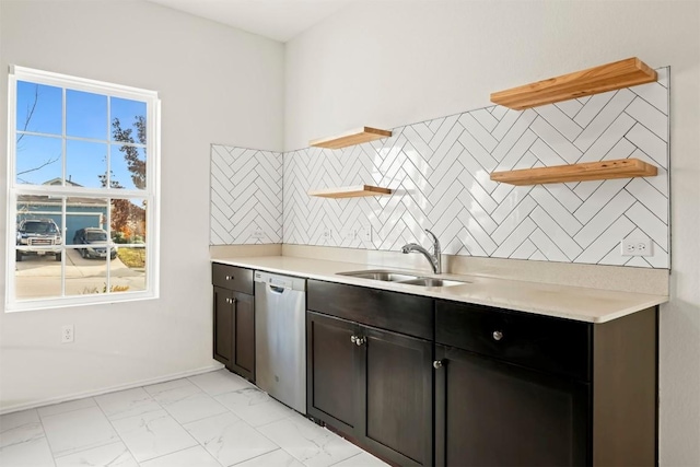 kitchen with dishwasher, decorative backsplash, dark brown cabinetry, and sink