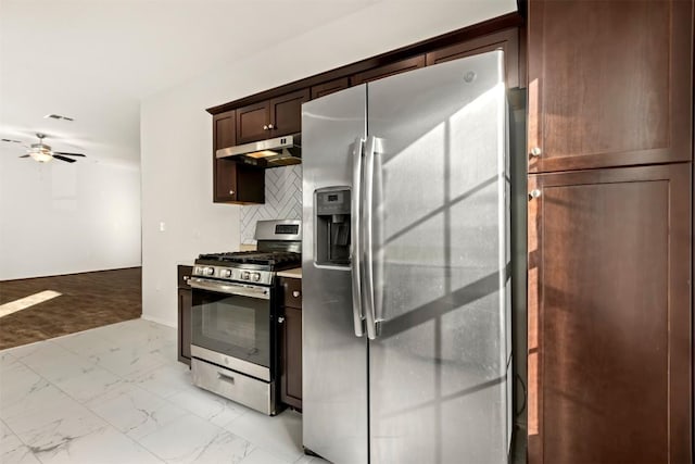 kitchen featuring backsplash, ceiling fan, and stainless steel appliances