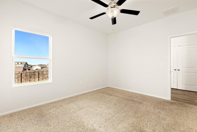 unfurnished room with carpet floors and ceiling fan