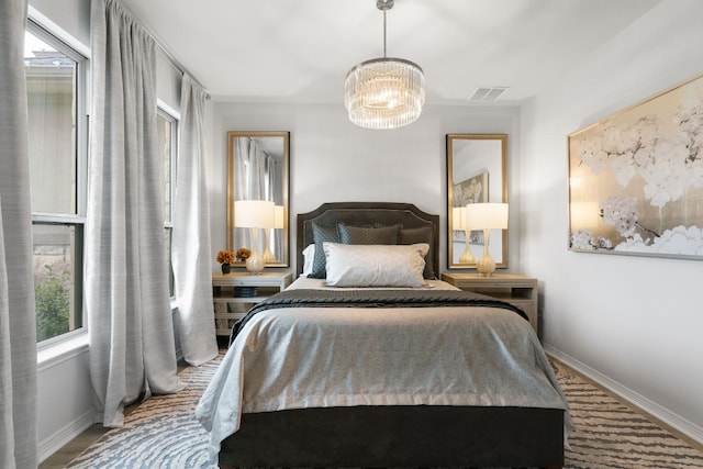 bedroom with a chandelier