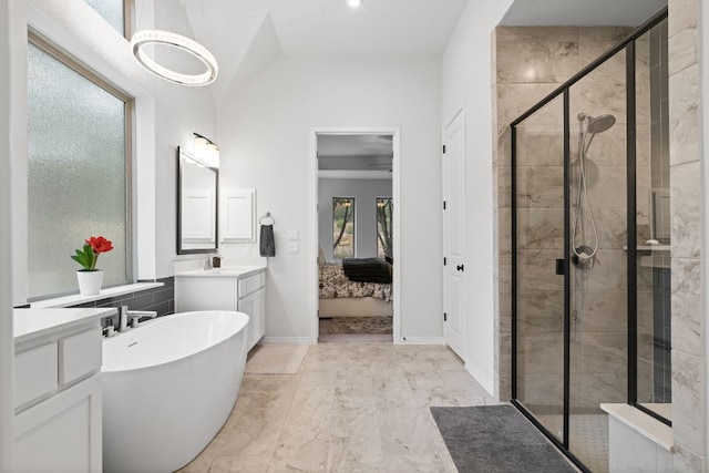 bathroom with vanity, lofted ceiling, and plus walk in shower