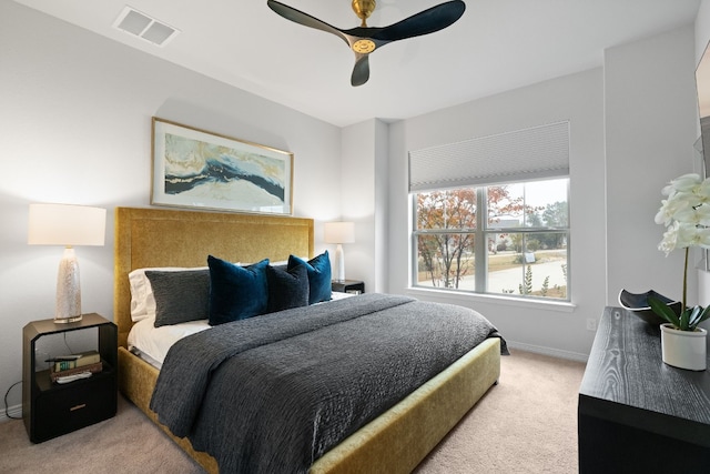 carpeted bedroom with ceiling fan