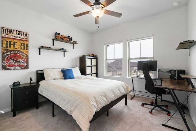 bedroom with ceiling fan and light colored carpet