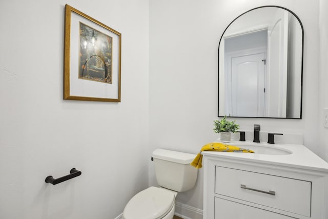 bathroom with toilet and vanity