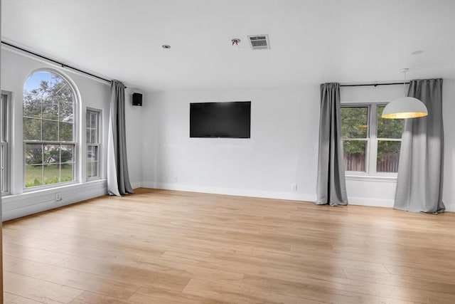 unfurnished living room featuring light hardwood / wood-style flooring