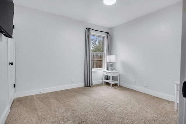 unfurnished room with carpet flooring