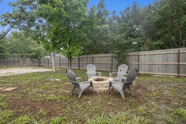 view of yard with a fire pit