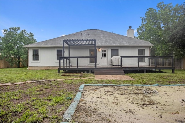 back of house featuring a pergola, a yard, and a deck