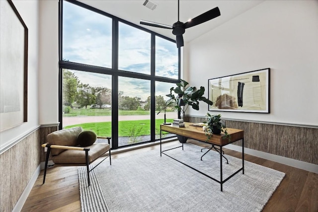 office area with ceiling fan, a healthy amount of sunlight, and wood-type flooring