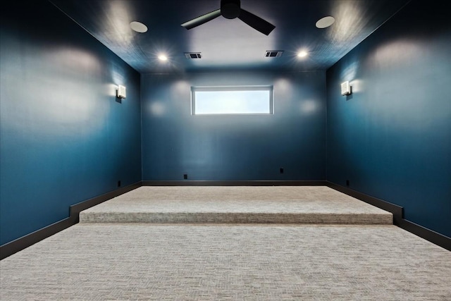 carpeted empty room featuring ceiling fan