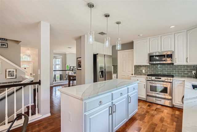 kitchen with white cabinetry, dark wood-type flooring, and appliances with stainless steel finishes