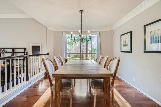 dining room featuring a chandelier, crown molding, and dark wood-type flooring