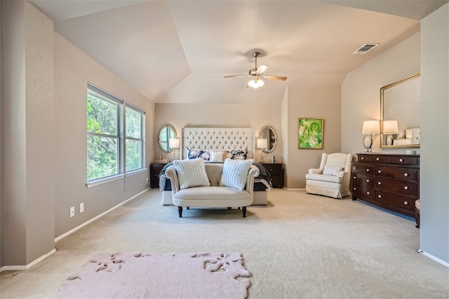 bedroom with ceiling fan, light carpet, and vaulted ceiling