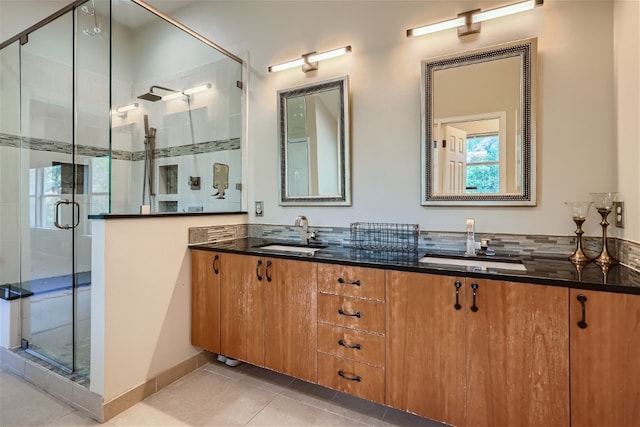 bathroom featuring tile patterned floors, vanity, and an enclosed shower