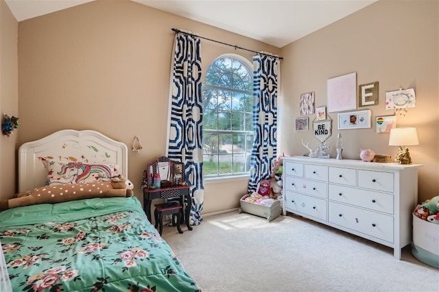 carpeted bedroom featuring lofted ceiling and multiple windows