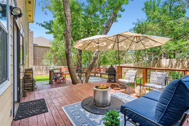 wooden terrace with an outdoor living space