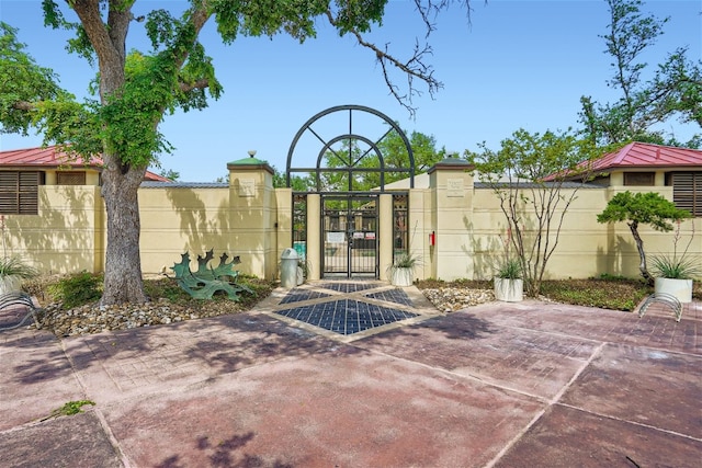 view of gate with fence