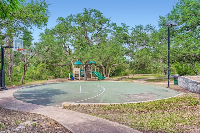 view of sport court featuring community basketball court and playground community