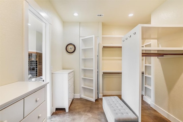 spacious closet with radiator heating unit