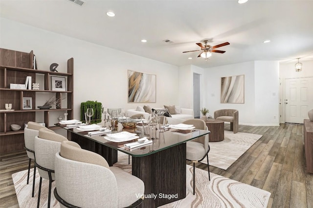 dining room with recessed lighting, visible vents, a ceiling fan, wood finished floors, and baseboards