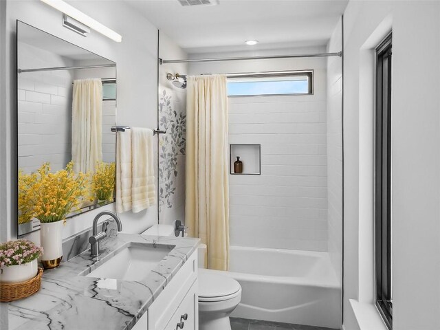 full bathroom featuring vanity, toilet, and shower / tub combo