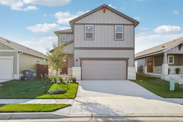 view of front of home featuring a front lawn and a garage