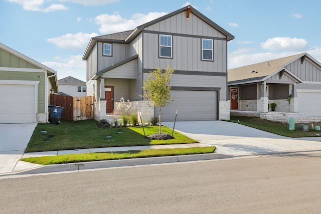 view of front of property with a front yard and a garage