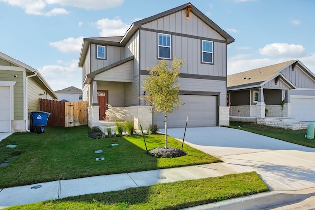 craftsman inspired home featuring a garage and a front lawn