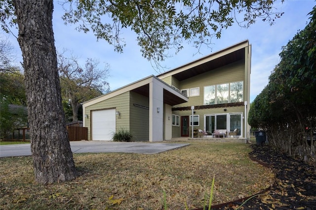 back of property with a porch and a garage