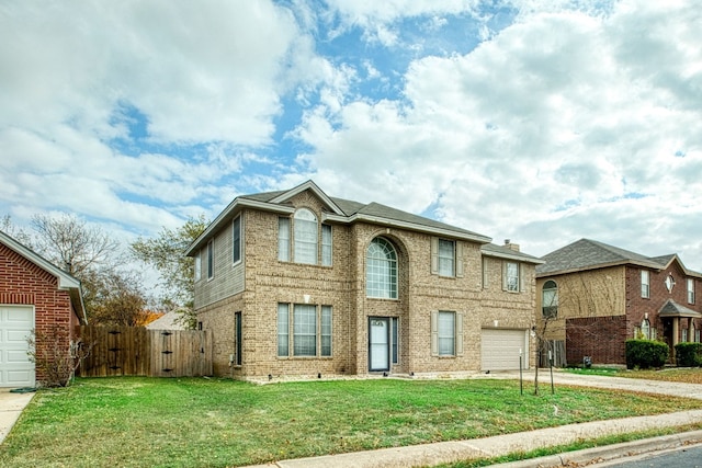 view of front facade featuring a garage and a front lawn