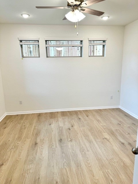 unfurnished room featuring plenty of natural light and light hardwood / wood-style floors