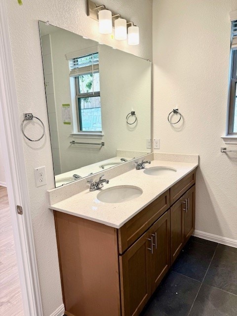 bathroom featuring tile patterned flooring and vanity