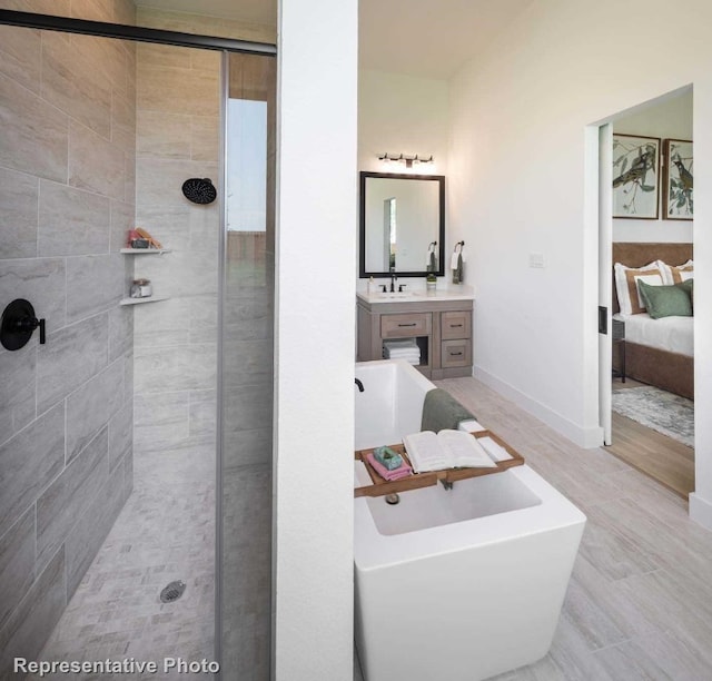 bathroom featuring plus walk in shower and vanity