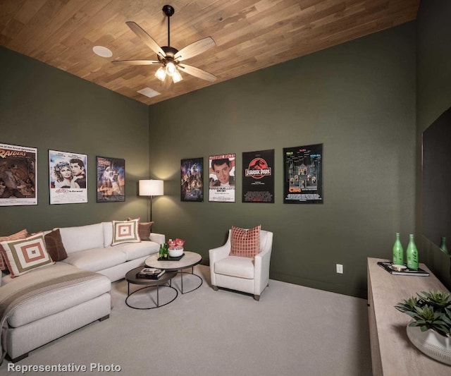 carpeted living room with vaulted ceiling, ceiling fan, and wood ceiling