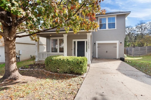 view of front of house featuring covered porch and a garage