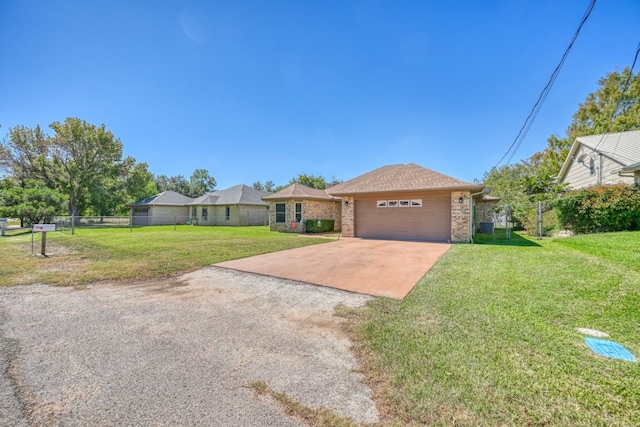 single story home with a garage and a front yard