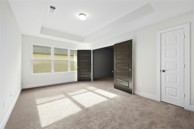 149 Golden Sage Ave, Georgetown, TX 78633 - unfurnished bedroom with carpet and a tray ceiling