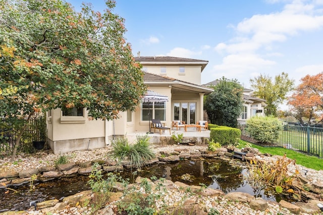 rear view of property featuring a patio