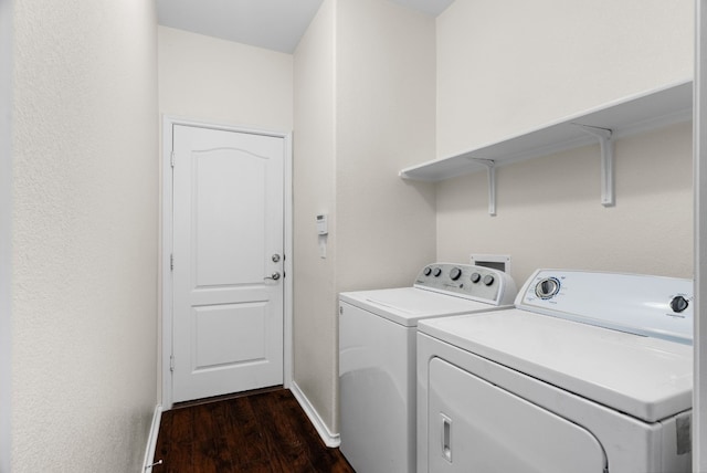 washroom with separate washer and dryer and dark hardwood / wood-style floors